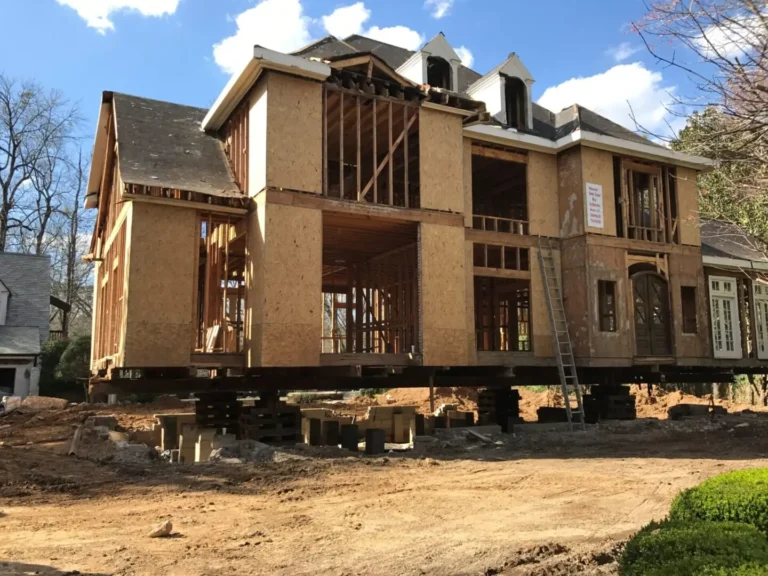 Sculac Homes lifting a 119-foot long house 5 feet to move it out of the flood plain for remodeling